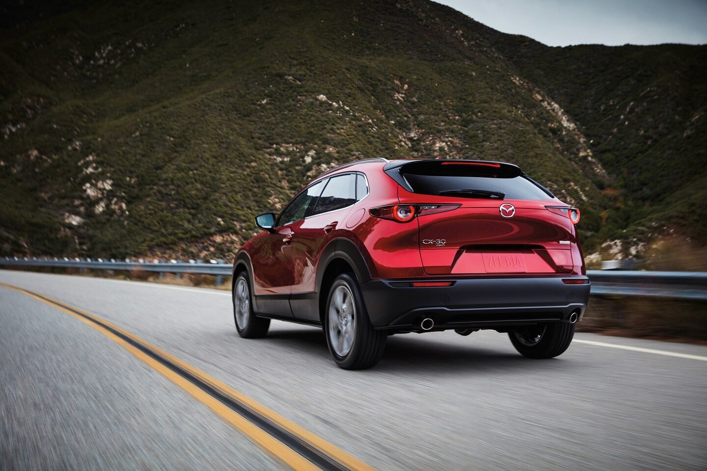 CX-30 in red driving on a highway