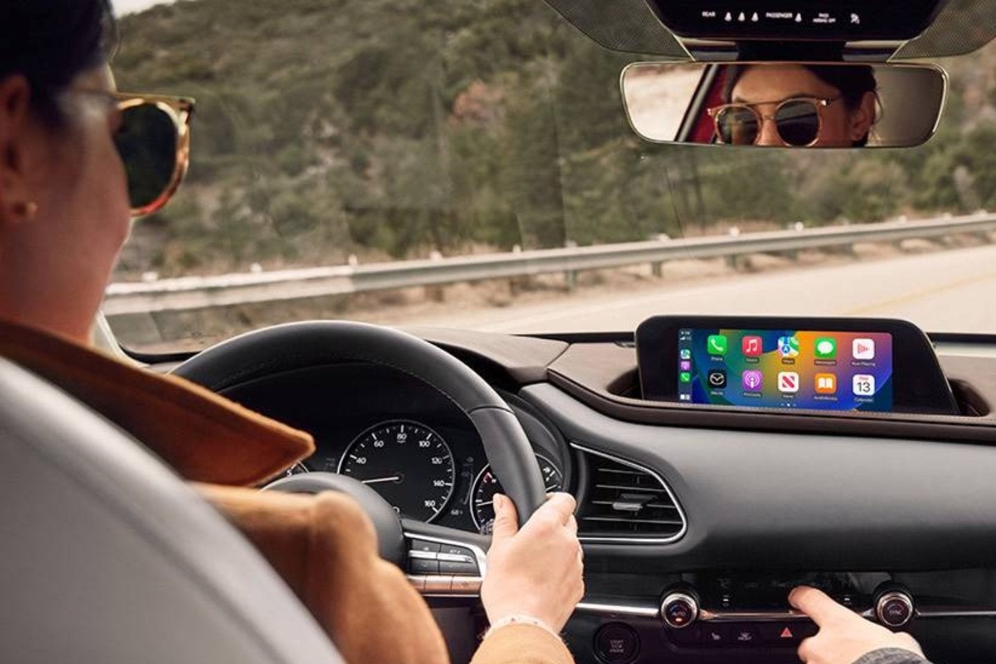 close up of a woman driving a CX-30 from Fitzgerald Mazda Frederick in Frederick MD 